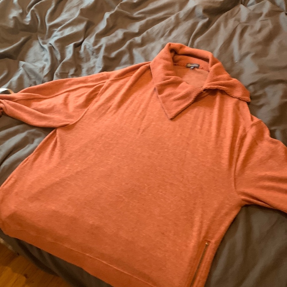 Soft pink asymmetric neck sweater with zipper detail